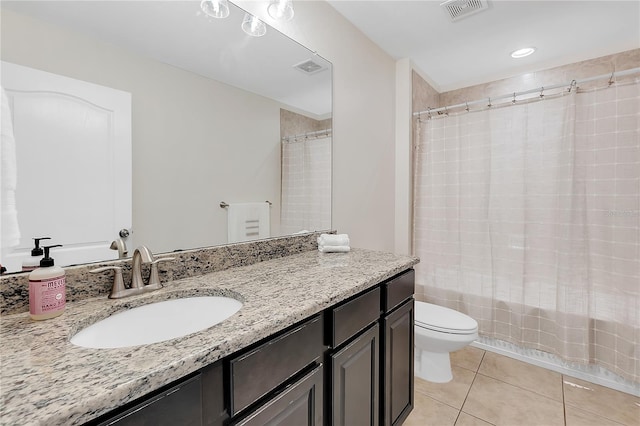 full bathroom featuring toilet, tile patterned flooring, shower / tub combo with curtain, and vanity