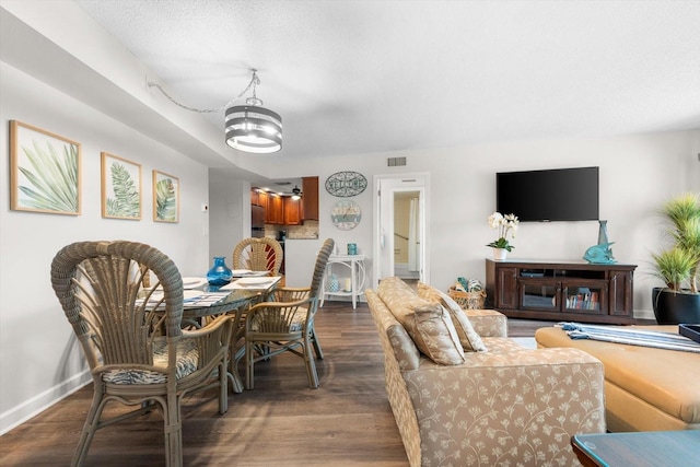 living room featuring dark hardwood / wood-style floors and a notable chandelier