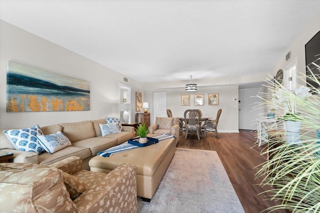 living room with dark hardwood / wood-style flooring