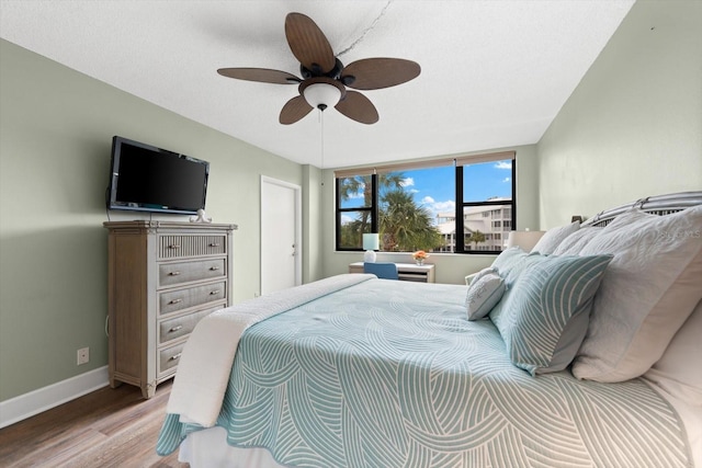 bedroom featuring ceiling fan and light wood-type flooring