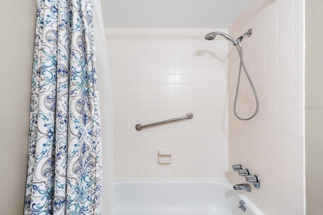 bathroom with shower / bath combination with curtain