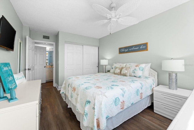 bedroom with ceiling fan, a closet, and dark hardwood / wood-style flooring