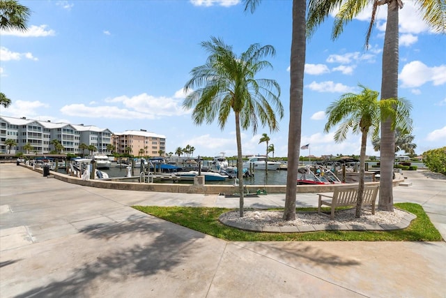 exterior space with a dock and a water view