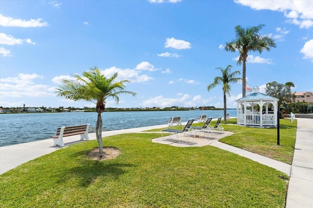 view of property's community featuring a water view, a gazebo, and a yard