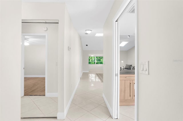 corridor with light tile patterned floors