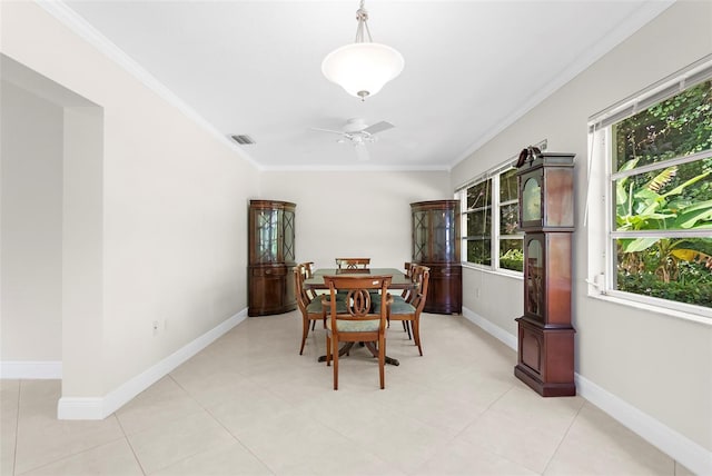 dining space with ceiling fan, a wealth of natural light, and ornamental molding