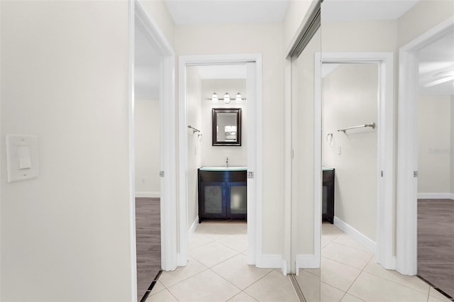 hall with light tile patterned flooring