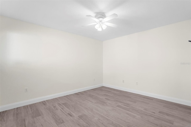 spare room with ceiling fan and light hardwood / wood-style floors