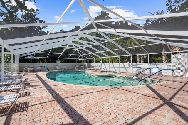 view of pool featuring a lanai and a patio