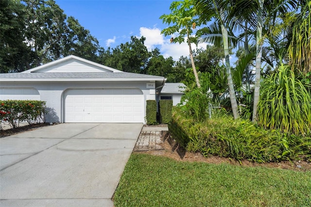 single story home with a garage