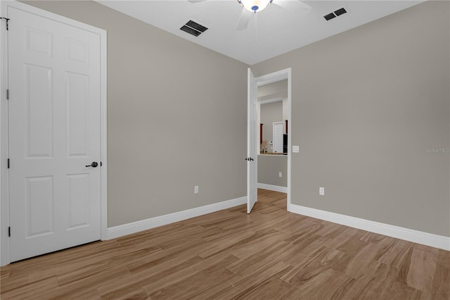 unfurnished bedroom featuring ceiling fan and light wood-type flooring