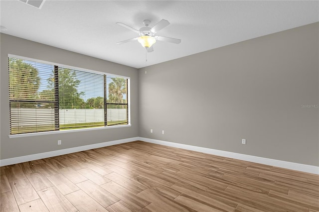 unfurnished room featuring ceiling fan and light hardwood / wood-style floors