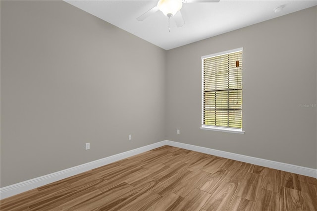 spare room featuring light wood-type flooring and ceiling fan