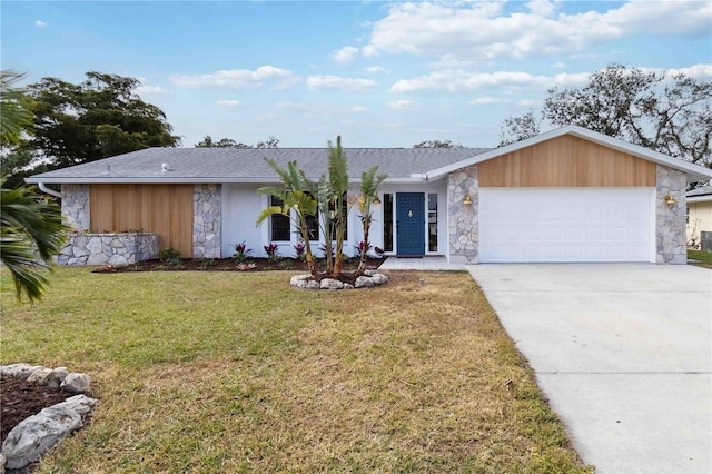 single story home with a front yard and a garage