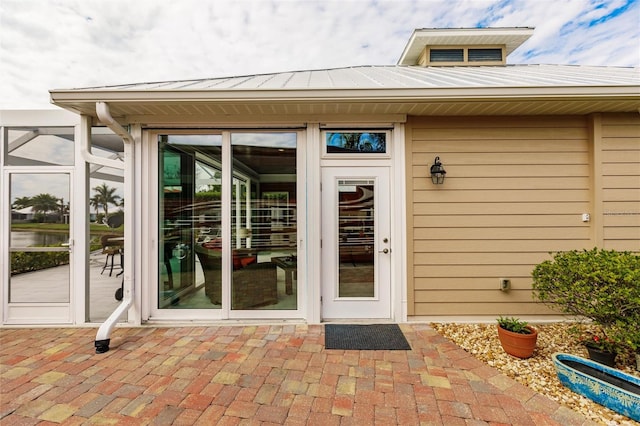 doorway to property with a patio