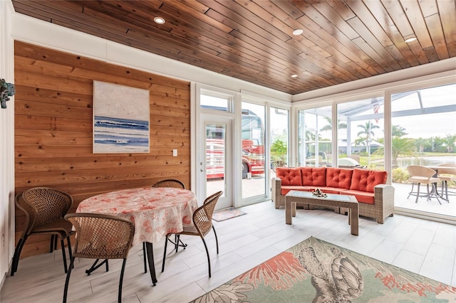 sunroom / solarium with plenty of natural light and wooden ceiling