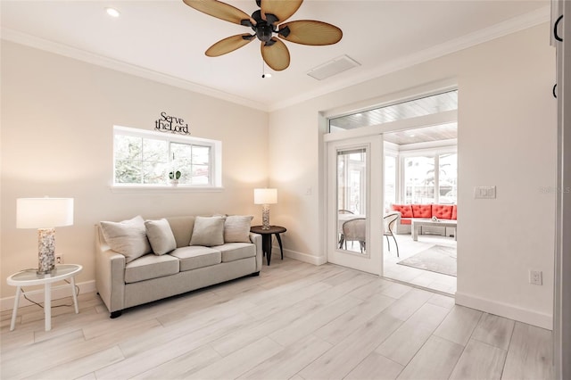 living room featuring ceiling fan, light hardwood / wood-style flooring, and ornamental molding