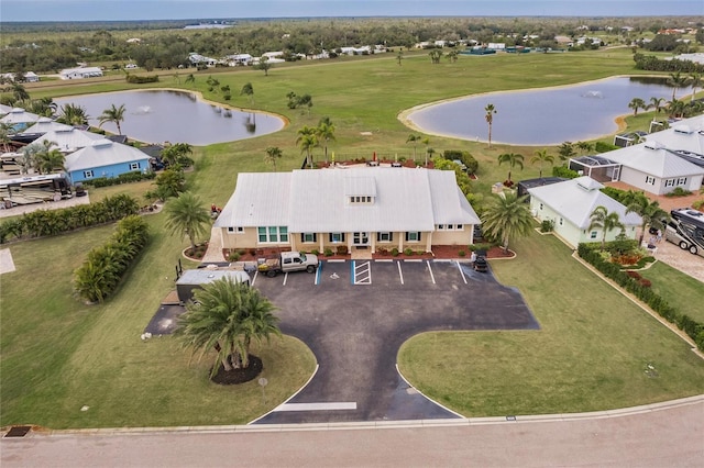 birds eye view of property with a water view