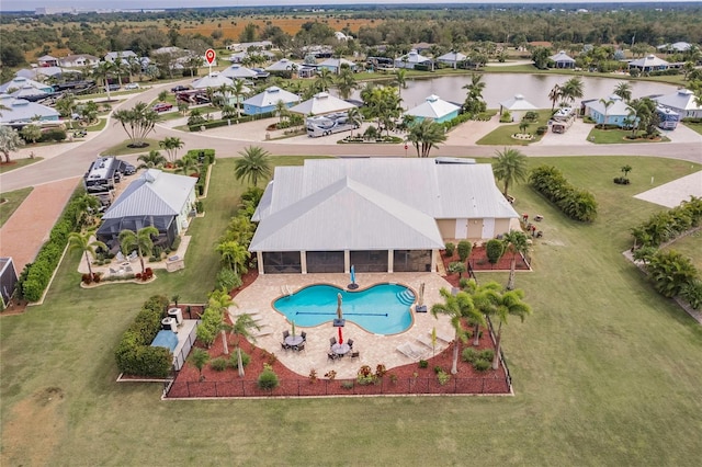 birds eye view of property with a water view