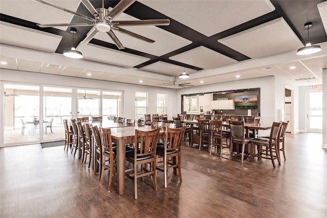 dining room featuring ceiling fan, dark wood-type flooring, and coffered ceiling