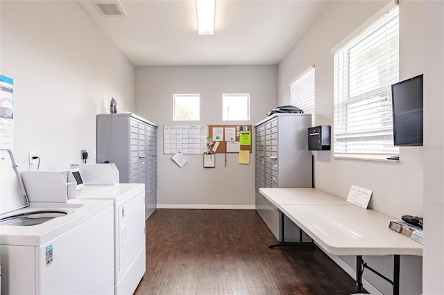 washroom with separate washer and dryer and dark hardwood / wood-style floors