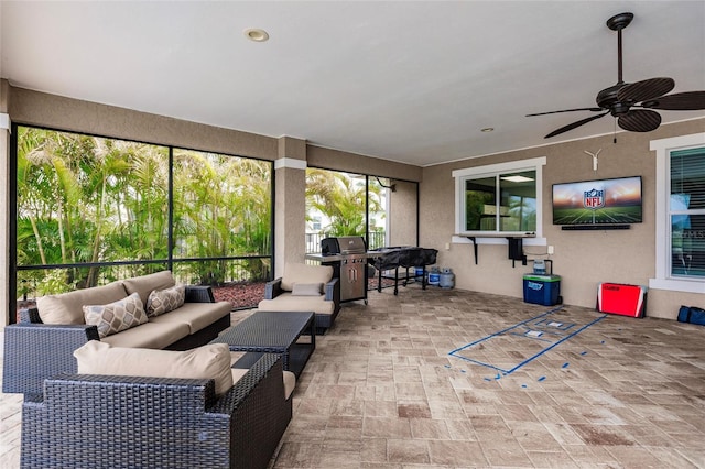 sunroom / solarium with ceiling fan