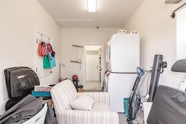 interior space with stacked washing maching and dryer