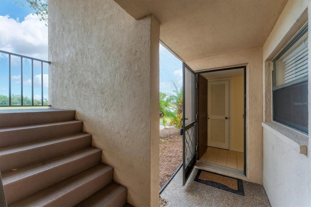 doorway to property featuring a balcony