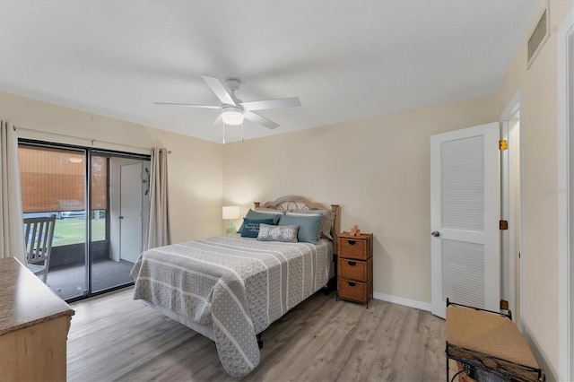 bedroom featuring ceiling fan, access to exterior, and light hardwood / wood-style flooring