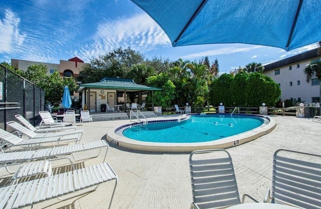 view of swimming pool with a patio area