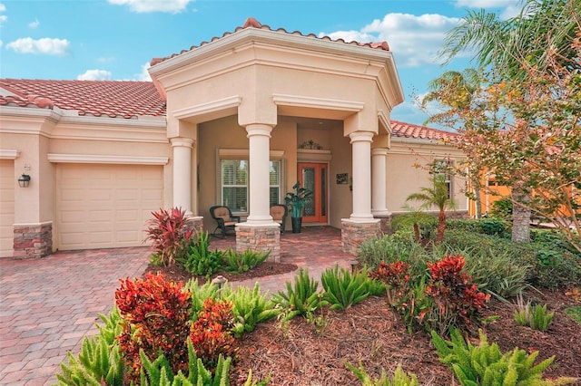 view of front of home featuring a garage and a porch