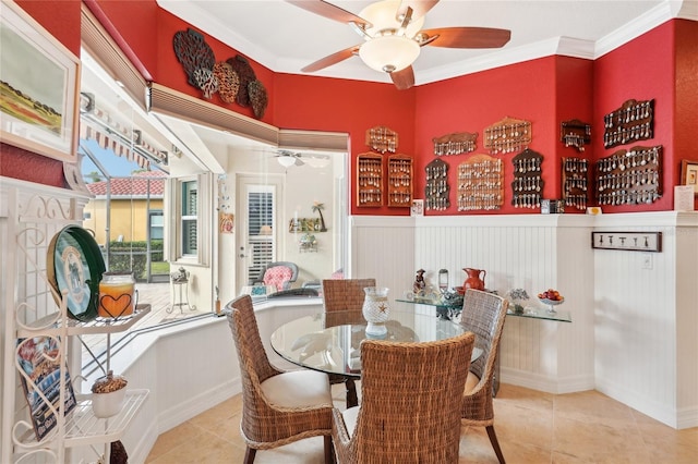 dining space featuring light tile patterned floors and ornamental molding