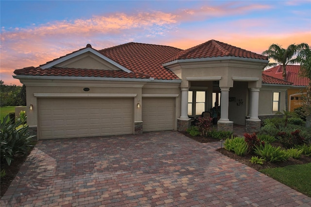 mediterranean / spanish-style house featuring a garage