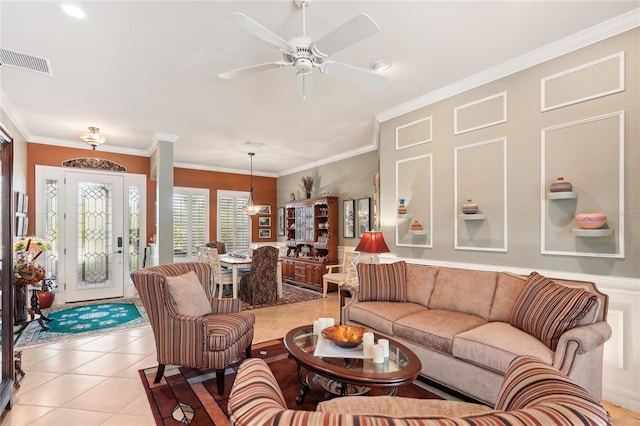 tiled living room featuring ceiling fan and ornamental molding