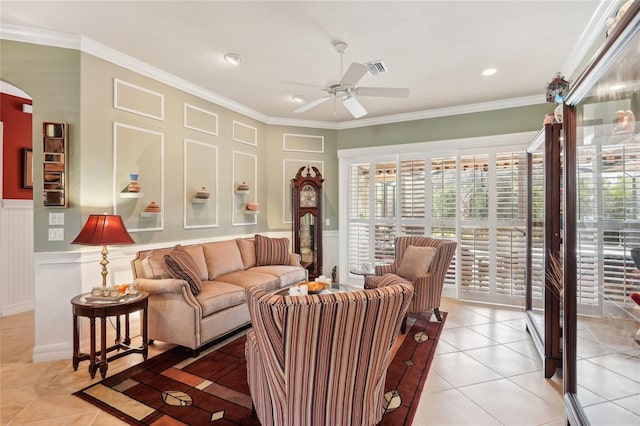 living room with ceiling fan, light tile patterned flooring, and crown molding