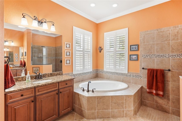 bathroom with plus walk in shower, vanity, ornamental molding, and tile patterned flooring