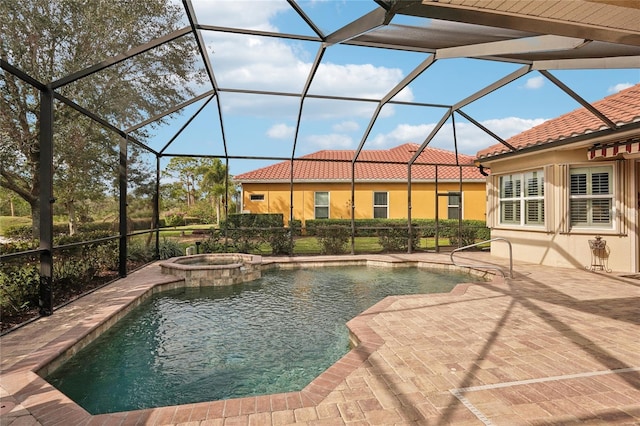 view of swimming pool with glass enclosure, a patio area, and an in ground hot tub