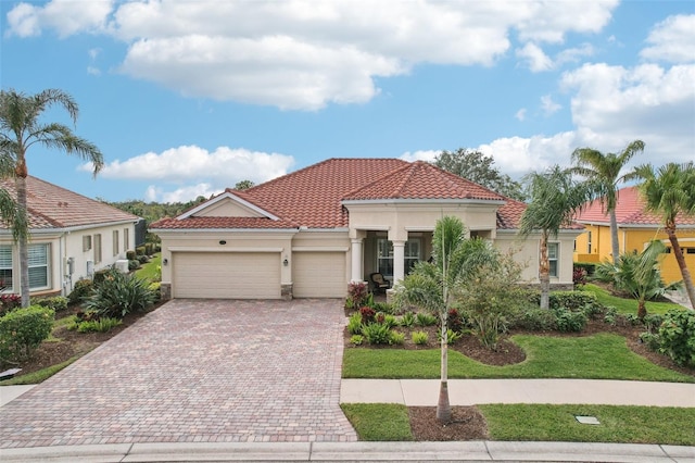 mediterranean / spanish-style home featuring a garage