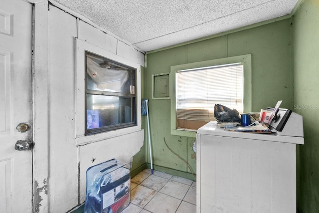 washroom featuring washer / dryer and light tile patterned floors