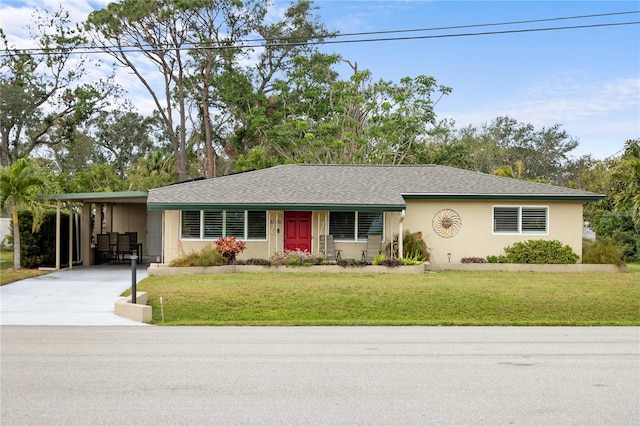 single story home featuring a carport and a front yard