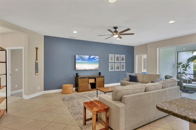 living room with ceiling fan and light tile patterned flooring