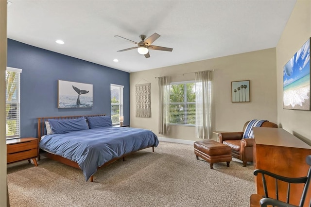 bedroom with ceiling fan and carpet floors