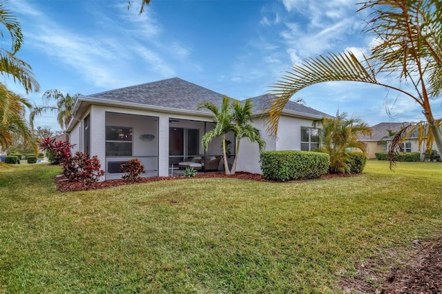 view of front of house with a front lawn and a sunroom