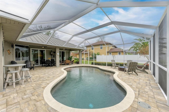 view of pool featuring a lanai and a patio