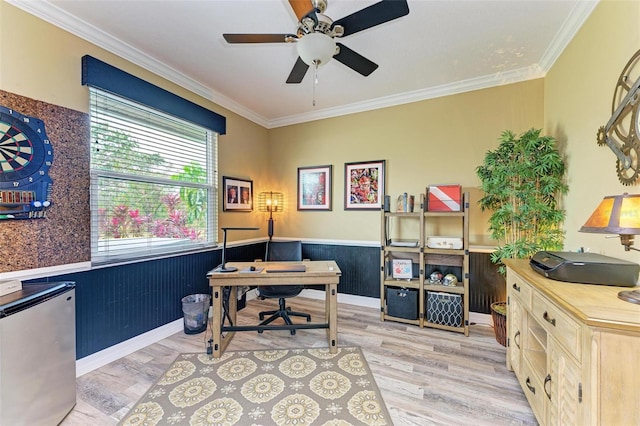 home office with ceiling fan, crown molding, and light hardwood / wood-style floors