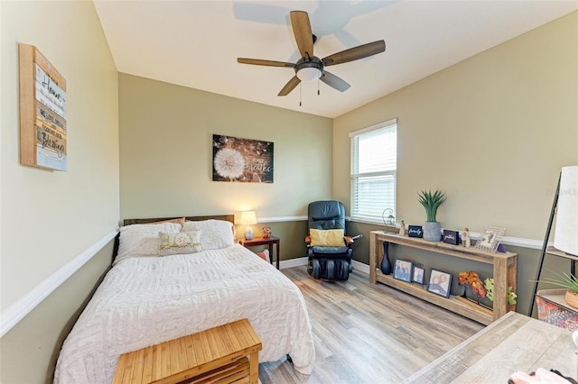 bedroom with light wood-type flooring and ceiling fan