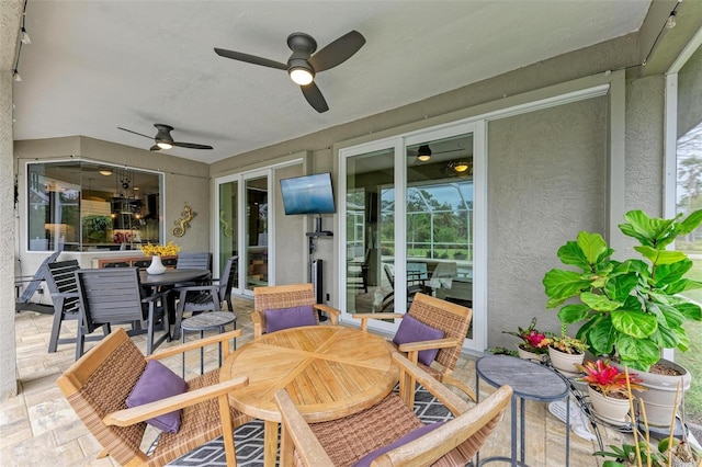 view of patio featuring ceiling fan