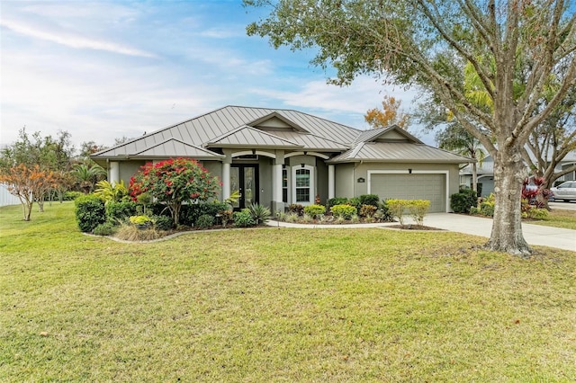 view of front facade featuring a front lawn and a garage