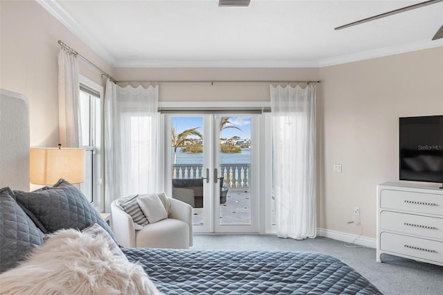 carpeted bedroom featuring access to exterior and crown molding