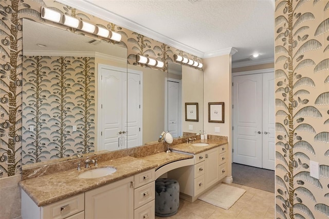 bathroom featuring a textured ceiling, tile patterned floors, vanity, and crown molding